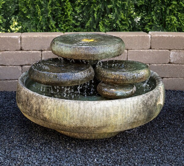 Water Lilies Fountain features shimmering pools of water unique cement